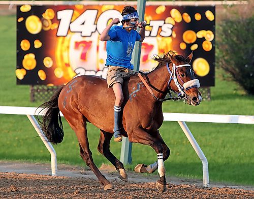 JASON HALSTEAD / FREE PRESS
Rider Caden Stanley of team Big Bad Wolf celebrates win during Manitoba Ahbee Indian Horse Relay Race action on May 20, 2024 at Assiniboia Downs.