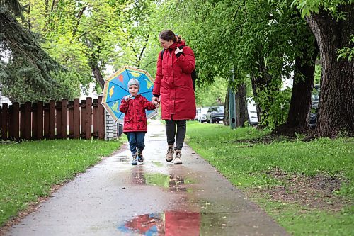 Ruth Bonneville / Free Press

Weather Standup - walking in the rain

Four-year-old Myroslav walks with his mom, Valentyna Seredynko, with his rain coat, boots and umbrella amidst the rain showers in St. Boniface Friday.  His mom was on her way to drop her son at daycare as she heads to her afternoon English class in the area. 


May 24th, 2024
