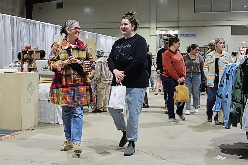 Mother and daughter, Cathie Hollier (left) and Emily Cullen enjoy their Saturday afternoon at the spring edition of the Apple and Pine Market held in the Manitoba Room at the Keystone Centre. (Michele McDougall/The Brandon Sun) 