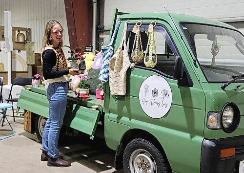 Brandon's Shelby Nohr stands beside her 1994 Suzuki Carry, a mini-truck from Japan. Nohr features crocheted pillows and plant holders through her business Sage Daisy Lily, and was one of 104 vendors at the Apple and Pine Market held in the Manitoba Room at the Keystone Centre on Saturday. (Michele McDougall/The Brandon Sun)