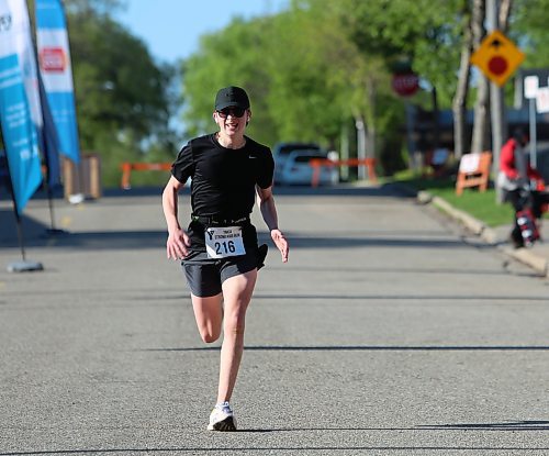 A runner picks up speed as she nears the finish line during the 45th annual YMCA Strong Kids Run on Sunday that started and ended in downtown Brandon. (Michele McDougall/The Brandon Sun)  