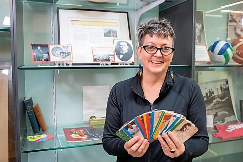 BROOK JONES / FREE PRESS
Longtime YMCA-YWCA volunteer Jakobina Jensen, 50, holds an inovation deck of cards which features significant historical dates related to the YMCA-YWCA. Jensen, who was pictured Friday, May 24, 2024, was involved with helping to put together a historical display at the downtown Y in Winnipeg, Man.