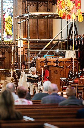 JOHN WOODS / FREE PRESS
Rev. Helen Holbrook leads a service at Holy Trinity Anglican Church Sunday, May 26, 2024. The church’s foundation is crumbling and the parish is looking for a buyer to help them rebuild it.

