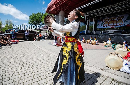 JOHN WOODS / FREE PRESS
Enjoo Jung, director of Red Lotus Korean dance group and other musicians perform during Taste of Asia at the Forks Sunday, May 26, 2024. 

Reporter: standup