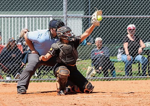 Westman Magic catcher Kaylee Rank of Brandon reaches up to gather a high pitch under the watchful eye of umpire Damien Mathys during a game against Central Energy in Manitoba Premier Softball League U15 action at Ashley Neufeld Softball Complex on Sunday afternoon. (Perry Bergson/The Brandon Sun)
May 26, 2024