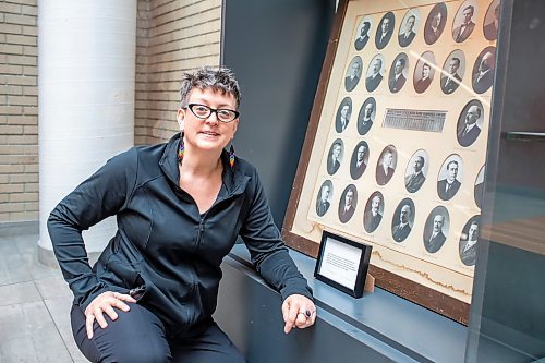 BROOK JONES / FREE PRESS
Longtime YMCA-YWCA volunteer Jakobina Jensen, 50, is pictured next to photographs of 30 business leaders who helped the community raise $350,000 for the downtown Y at 301 Vaughan Street n 1911, which wouild be equivalent to more than $10 milllion today. Jensen, is pictured Friday, May 24, 2024, was involved with helping to put together a display featuring historical YMCA-YWCA items at the downtown Y in Winnipeg, Man.