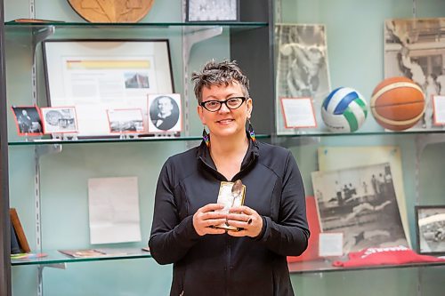 BROOK JONES / FREE PRESS
Longtime YMCA-YWCA volunteer Jakobina Jensen, 50, holds a YMCA-YWCA silver spoon, which belonged to Daisy Williams. The spoon which was passed down to the Y by Williams' grandchild Pat Thompson features a stamp impression of the downtown Y building where Williams stayed at when she arrived in Winnipeg from England in the early 1920s. Jensen, who is pictured Friday, May 24, 2024, was involved with helping to put together historical items for a display at the downtown Y in Winnipeg, Man.