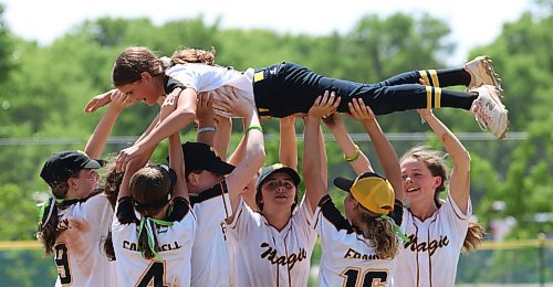 Quinn Twordik is hoisted in the air by her under-13 Westman Magic teammates in 2022 as part of their choreographed dance after they won their division at the International Classic at the Ashley Neufeld Softball Complex. (Perry Bergson/The Brandon Sun)