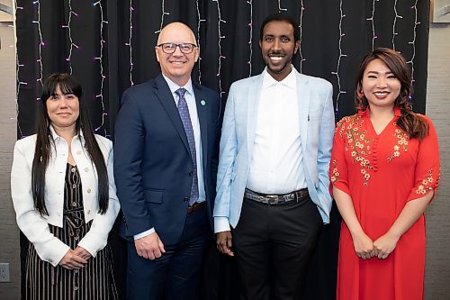 BROOK JONES / FREE PRESS
From Left: Winnipeg Mayor Scott Gillingham (second from far left) is pictured with Bilal commmunity and Family Services executive director Muhiain Omar (second from far right), award receipient Winnipeg Centre MP Leah Gazan (far left) and Fort Richmond MLA Jennifer Chen (right)at the Aslamic Social Services volunteers Zoubaida Al Lilo and Noor Al Ahmad at the Islamic Social Services Association's 25th Anniversary Fundraising Gala Dinner was hosted at the Hilton Suites in Winnipeg,Man., Thursday, May 23, 2024. The event honoured the advocacy works of 10 community builders, including Uzoma Asagwara, Jennifer Chen, Shawn Feely, Leah Gazan, Harun Kibirige, Dr. Andrew McLean, Diane Redsky, Haroon Siddigui, Ramsey Zeid and the Winnipeg Foundation.