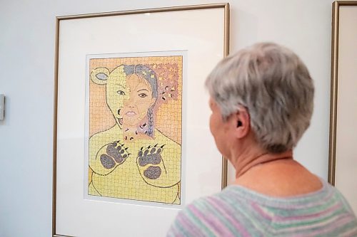 BROOK JONES / FREE PRESS
Darlene Coward Wight who is the Winnipeg Art Gallery-Qaumajuq Curator of Inuit Art is pictured looking at Untitled (Shaman's Transformation, 2013), which is included in the Omalluq: Pictures from my Life exhibit and features work by Kinngait artist Omalluq Oshutsiaq at the WAG-Qaumajuq in Winnipeg, Man., Friday, May 24, 2024. This particular piece of artwork was done with graphite, coloured pencil and a felt-tip pen on paper. Oshutsiaq began drawing during the last two years of her life and died in 2014.. The art exhibit runs until March 30, 2025.