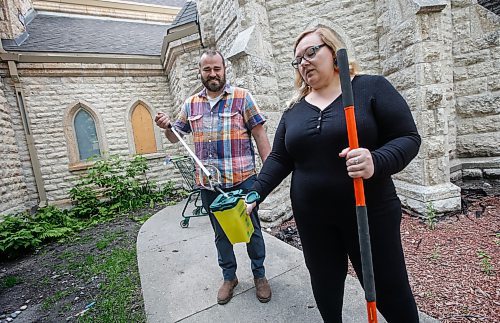 JOHN WOODS / FREE PRESS
Michael Minor, rector&#x2019;s warden, and Sandra Bender, people&#x2019;s warden, search for used needles outside Holy Trinity church in downtown Winnipeg Tuesday, May 28, 2024. Allegedly downtown churches are facing security challenges.

Reporter: john