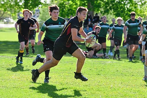 Crocus Plainsmen ball carrier Kayden McEachern (12) had plenty of long, hard runs, but was unable to score a try during the Westman High School Rugby league final Tuesday night, with the Dauphin Clippers prevailing 31-21. (Photos by Jules Xavier/The Brandon Sun