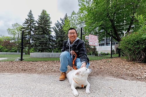 MIKE DEAL / FREE PRESS
Yidan Zhu with their dog, Dou Dou, at the Bonnycastle Dog Park at Assiniboine Avenue and Garry Street, Tuesday afternoon.
240528 - Tuesday, May 28, 2024.