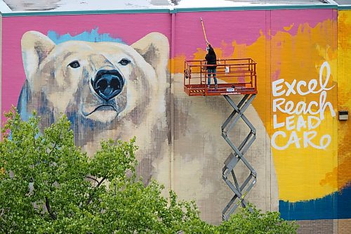 MIKE DEAL / FREE PRESS
Artist Kal Barteski works on a huge 36 x 110 foot (approximately 300 square metres) in-progress mural, located at Balmoral Hall School. The donor-funded initiative celebrate&#x2019;s the school&#x2019;s inclusive girls&#x2019; education program and Barteski says is inspired by bold, creative, fearless females, &#x201c;looking forward as strong, caring leaders of our communities and world.&#x201d;
240528 - Tuesday, May 28, 2024.