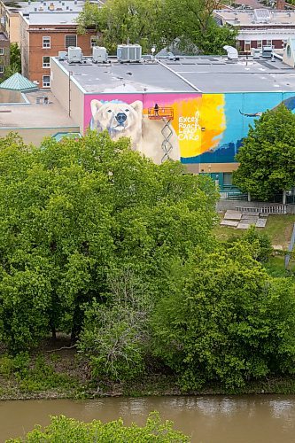 MIKE DEAL / FREE PRESS
Artist Kal Barteski works on a huge 36 x 110 foot (approximately 300 square metres) in-progress mural, located at Balmoral Hall School. The donor-funded initiative celebrate&#x2019;s the school&#x2019;s inclusive girls&#x2019; education program and Barteski says is inspired by bold, creative, fearless females, &#x201c;looking forward as strong, caring leaders of our communities and world.&#x201d;
240528 - Tuesday, May 28, 2024.