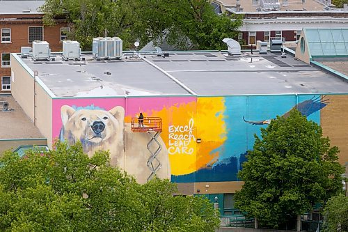 MIKE DEAL / FREE PRESS
Artist Kal Barteski works on a huge 36 x 110 foot (approximately 300 square metres) in-progress mural, located at Balmoral Hall School. The donor-funded initiative celebrate&#x2019;s the school&#x2019;s inclusive girls&#x2019; education program and Barteski says is inspired by bold, creative, fearless females, &#x201c;looking forward as strong, caring leaders of our communities and world.&#x201d;
240528 - Tuesday, May 28, 2024.