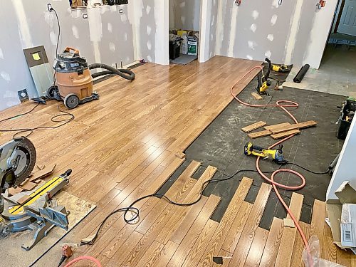 Photos by Marc LaBossiere / Free Press
Every second hardwood plank of the existing floor at the old wall line was removed to interlace new boards to best conceal the seam. 