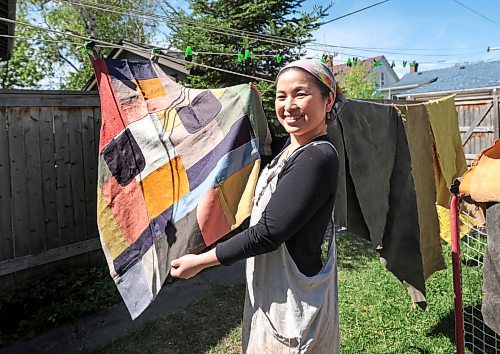 Ruth Bonneville / Free Press

49.8 The CREATORS - Michino 

Michino Tsuboi Phillips  in her home workshop and dyeing and hanging material on the line.  

Story: 49.8 The Creators
Michino makes hand-dyed aprons from heavy cottons and denims. She uses plants and flowers which she grows in her backyard to dye the materials which she then converts into aprons and bags.  

Photos of her in her workshop and  in the dyeing process outside her home her back garden. 

AV Kitching 
Writer, Arts &amp; Life, The Free Press

May 23rd, 2024
