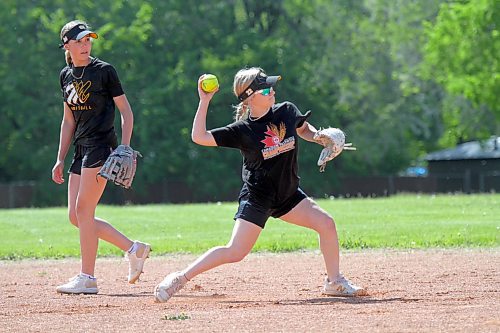 Sophomore shortstop Kendra Grift turns a double play while Brynna Andrew looks on during the Vincent Massey Vikings last practice before fast-pitch provincials on Wednesday. (Thomas Friesen/The Brandon Sun)