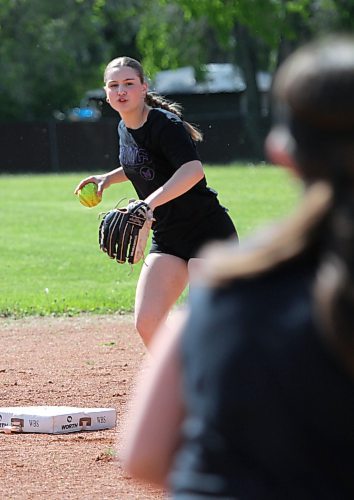 Kelsey Huibers winds up to throw to third base. (Thomas Friesen/The Brandon Sun)