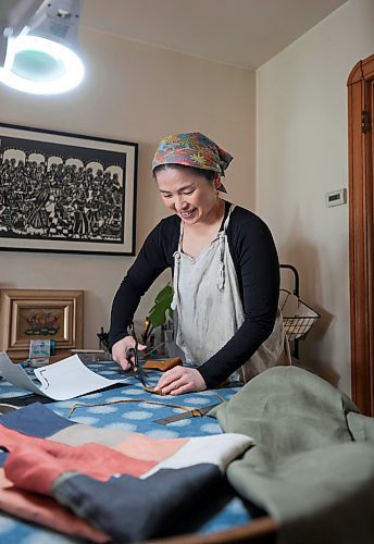 Ruth Bonneville / Free Press

49.8 The CREATORS - Michino 

Michino Tsuboi Phillips  in her home workshop and dyeing and hanging material on the line.  

Story: 49.8 The Creators
Michino makes hand-dyed aprons from heavy cottons and denims. She uses plants and flowers which she grows in her backyard to dye the materials which she then converts into aprons and bags.  

Photos of her in her workshop and  in the dyeing process outside her home her back garden. 

AV Kitching 
Writer, Arts &amp; Life, The Free Press

May 23rd, 2024
