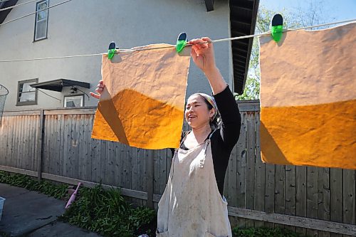 Ruth Bonneville / Free Press

49.8 The CREATORS - Michino 

Michino Tsuboi Phillips  in her home workshop and dyeing and hanging material on the line.  

Story: 49.8 The Creators
Michino makes hand-dyed aprons from heavy cottons and denims. She uses plants and flowers which she grows in her backyard to dye the materials which she then converts into aprons and bags.  

Photos of her in her workshop and  in the dyeing process outside her home her back garden. 

AV Kitching 
Writer, Arts &amp; Life, The Free Press

May 23rd, 2024
