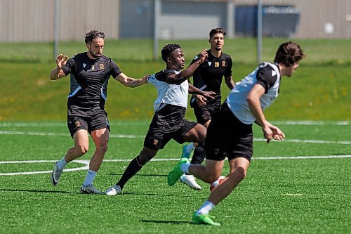 MIKE DEAL / FREE PRESS
Valour FC Raphael Ohin charges ahead while Jordan Swibel tries to slow him down during practice at the Ralph Cantafio Soccer Complex Wednesday.
240529 - Wednesday, May 29, 2024.