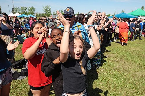 29052024
Students from King George School cheer for Indigenous graduates from the school as they take part in the Our Journey: Celebrating Indigenous Student Success event at the Riverbank Discovery Centre on Wednesday. The event honoured Indigenous students including graduates from local elementary schools, high schools and college/university. It included a powwow, a pipe ceremony, a BBQ lunch and a late afternoon feast. 
(Tim Smith/The Brandon Sun)