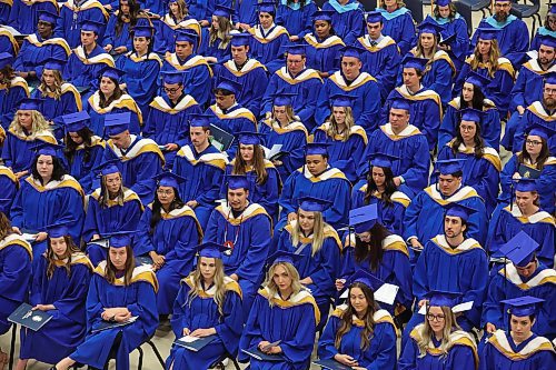 Graduates listen to chancellor Mary Jane McCallum’s greetings during Brandon University’s convocation for the faculty of education at the BU Healthy Living Centre on Thursday. (Tim Smith/The Brandon Sun)