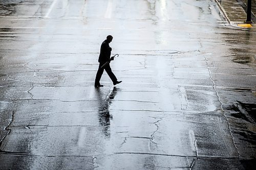 Mike Sudoma/Free Press
An umbrella wielding civilian makes their way north on Edmonton St near the RBC Convention Centre during Thursday afternoons rainfall
May 30, 2024