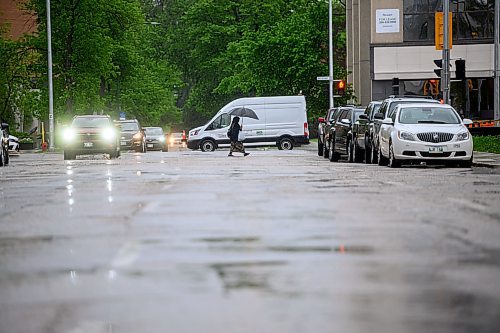 Mike Sudoma/Free Press
An umbrella wielding civilian makes their way west on Broadway and Edmonton St during Thursday afternoons rainfall
May 30, 2024