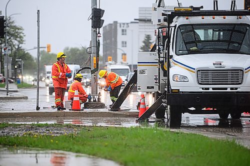 Mike Sudoma/Free Press
Manitoba Hydro workers fix a traffic light that was run into by a car Thursday afternoon
May 30, 2024