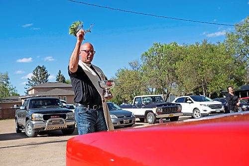 30052024
Father Chris Arthur with Redeemer-St. George&#x2019;s Church in Brandon blesses cars during The Road Rebels Blessing of the Wheels Car Show on Thursday evening. The event included a BBQ with proceeds going to the Anglican Memorial Camp. Local car enthusiasts brought their cars to be blessed.
(Tim Smith/The Brandon Sun)