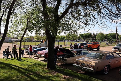 30052024
Car enthusiasts mingle during The Road Rebels Blessing of the Wheels Car Show at Redeemer-St. George&#x2019;s Church on Thursday evening. The event included a BBQ with proceeds going to the Anglican Memorial Camp. Local car enthusiasts brought their cars to be blessed by Father Chris Arthur. 
(Tim Smith/The Brandon Sun)