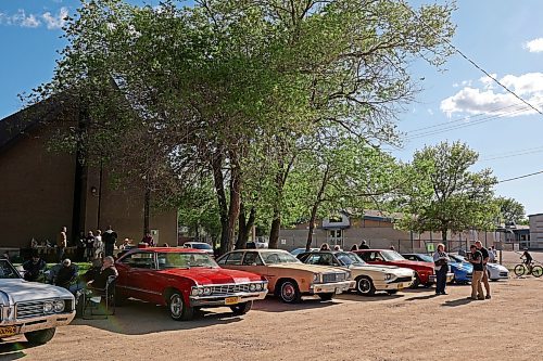 30052024
Car enthusiasts mingle during The Road Rebels Blessing of the Wheels Car Show at Redeemer-St. George&#x2019;s Church on Thursday evening. The event included a BBQ with proceeds going to the Anglican Memorial Camp. Local car enthusiasts brought their cars to be blessed by Father Chris Arthur. 
(Tim Smith/The Brandon Sun)