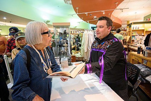 Mike Sudoma/Free Press
Writer Niigaan Sinclair hands K&#xe8;t&#xe8;skwew Dion Stout a copy of his new book Winip&#xea;k; Visions of Canada from an Indigenous Centre during a launch party at McNally Robinson Thursday night
May 30, 2024