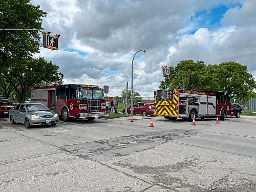 A pedestrian was hit on Burrows Avenue at Shaughnessy Street Thursday afternoon. (Russell Wangersky / Winnipeg Free Press)