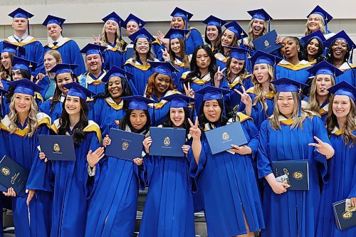 Graduates ham it up for photos after Brandon University’s convocation for the faculty of health studies at the BU Healthy Living Centre on Friday morning. See stories on pages A4 and A5. (Tim Smith/The Brandon Sun)