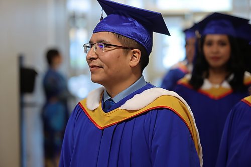 Enoch Ouskun walks into the convocation hall on Friday. (Abiola Odutola/The Brandon Sun)