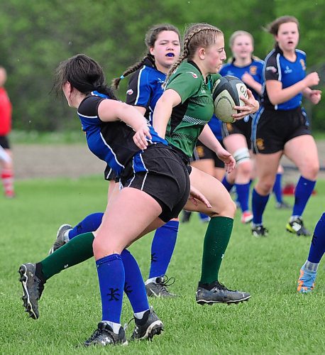 Finding a gap in the Souris Sabres defence, Dauphin Clippers co-captain Bree Walker runs through en route for a try during the Manitoba High Schools Athletic Association provincials held at Kin Field Friday afternoon. Walker will rugby with the U Sport's University of Calgary Dinos this fall. (Jules Xavier/The Brandon Sun)