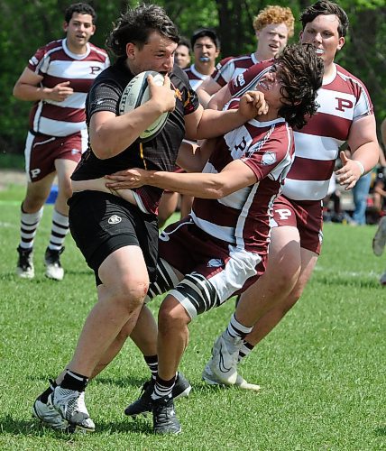 There were plenty of heavy collisions on the rugby pitch in Dauphin Friday afternoon when the Clippers hosted the Manitoba High Schools Athletic Association provincials. Here, Crocus Plainsmen and St. Paul's Crusaders collide at midfield. St. Paul's prevailed 48-19 and will face the winner of the Dauphin-Dakota game in today's gold medal game. The loser will face Crocus for bronze. (Jules Xavier/The Brandon Sun)