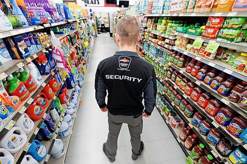 MIKE DEAL / FREE PRESS ILLUSTRATION 
An Impact Security guard walks down a grocery isle.
240531 - Friday, May 31, 2024.