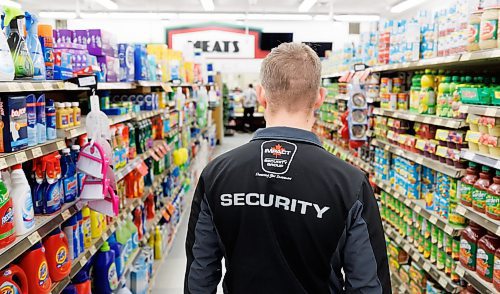 MIKE DEAL / FREE PRESS ILLUSTRATION 
An Impact Security guard walks down a grocery isle.
240531 - Friday, May 31, 2024.