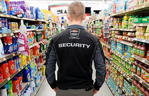 MIKE DEAL / FREE PRESS ILLUSTRATION 
An Impact Security guard walks down a grocery isle.
240531 - Friday, May 31, 2024.