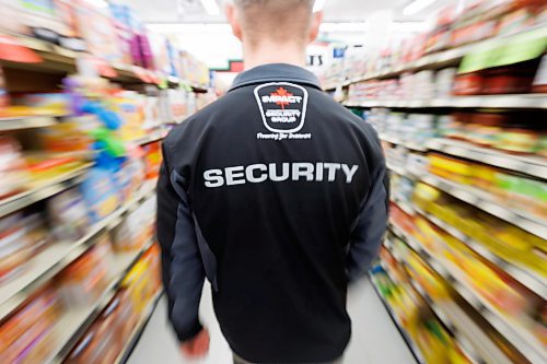 MIKE DEAL / FREE PRESS ILLUSTRATION 
An Impact Security guard walks down a grocery isle.
240531 - Friday, May 31, 2024.