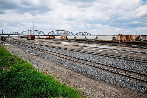 Mike Sudoma/Free Press
The Arlington Bridge stands tall behind the CP Railcards along Higgins Avenue Friday afternoon
May 31, 2024