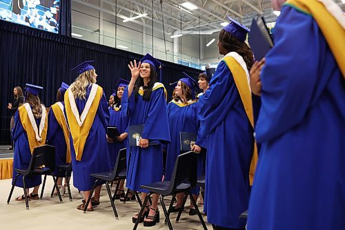 31052024
A graduate waves to supporters in the crowd at the end of Brandon University&#x2019;s convocation for the Faculty of Health Studies at the BU Healthy Living Centre on Friday morning. 
(Tim Smith/The Brandon Sun)