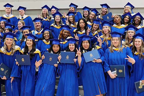 31052024
Graduates ham it up for photos after Brandon University&#x2019;s convocation for the Faculty of Health Studies at the BU Healthy Living Centre on Friday morning. 
(Tim Smith/The Brandon Sun)