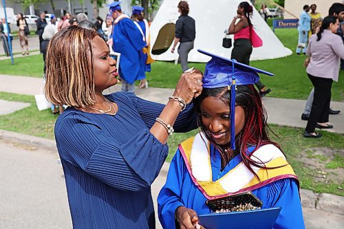 31052024
Simi Azeez, a bachelor of nursing with distinction graduate, has her mortarboard adjusted by her mom Adejoke Azeez before taking photos together after Brandon University&#x2019;s convocation for the Faculty of Health Studies at the BU Healthy Living Centre on Friday morning. 
(Tim Smith/The Brandon Sun)