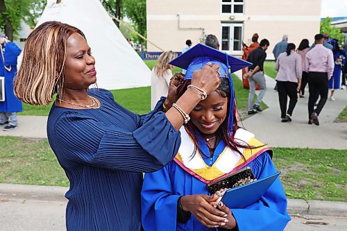 31052024
Simi Azeez, a bachelor of nursing with distinction graduate, has her mortarboard adjusted by her mom Adejoke Azeez before taking photos together after Brandon University&#x2019;s convocation for the Faculty of Health Studies at the BU Healthy Living Centre on Friday morning. 
(Tim Smith/The Brandon Sun)